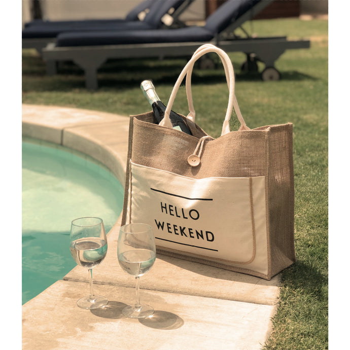 large tote bag 2 wine glass next to pool